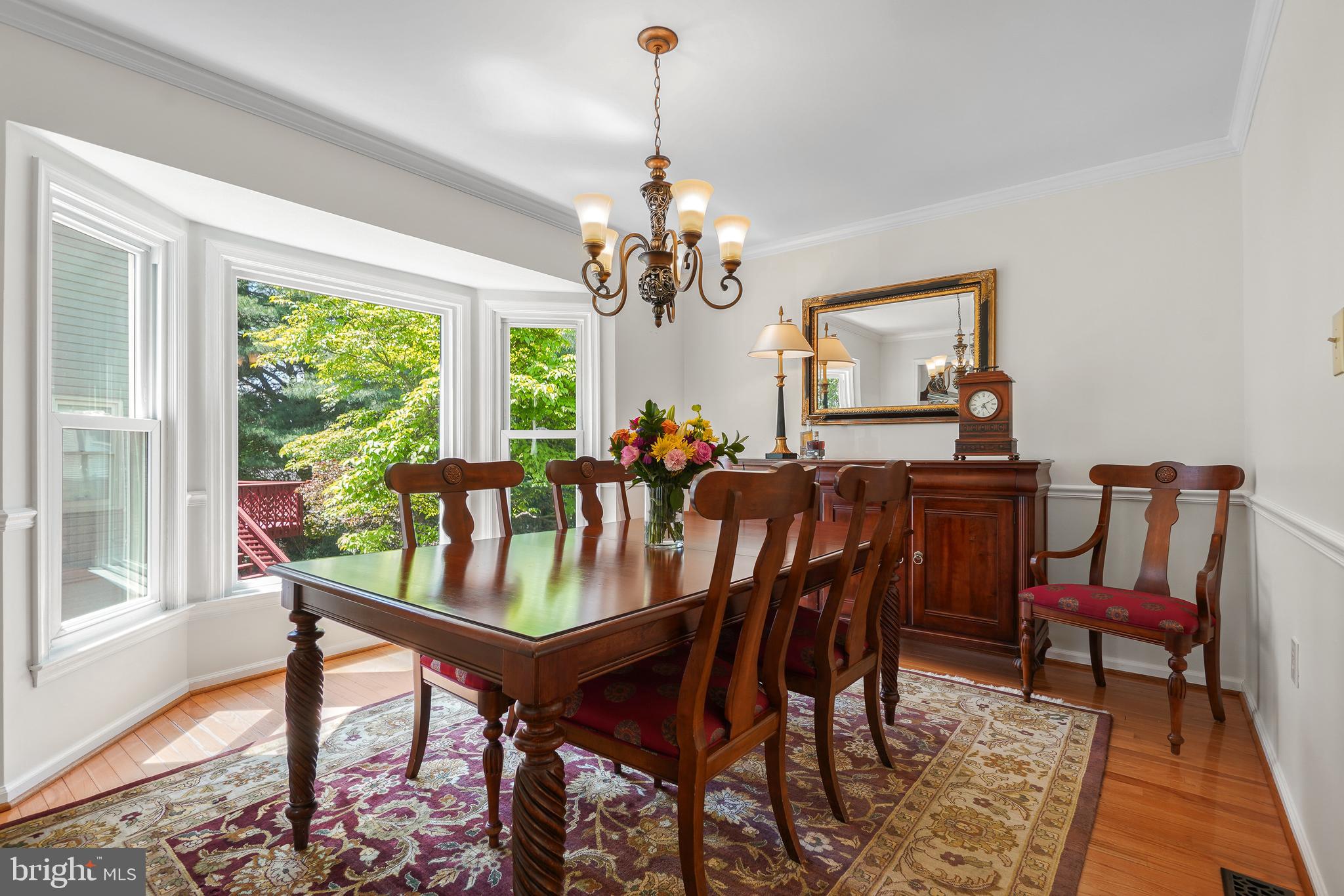 130 Englefield Drive Gaithersburg, MD 20878 - Photo 9 of 33 a dining room with furniture a large window and a chandelier