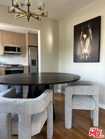 a kitchen with a table and chairs
