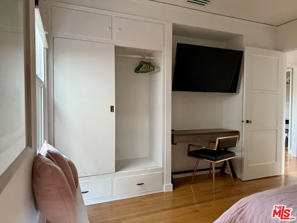 a view of a livingroom with furniture and wooden floor