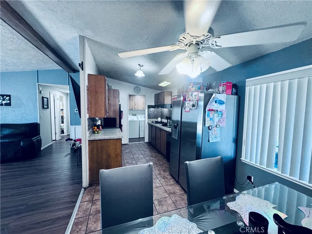 250 North Linden Avenue, Unit 250 Rialto, CA 92376 - Photo 11 of 29 a living room with furniture and kitchen view