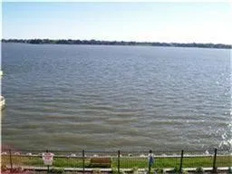 a view of a lake and mountain in front of it