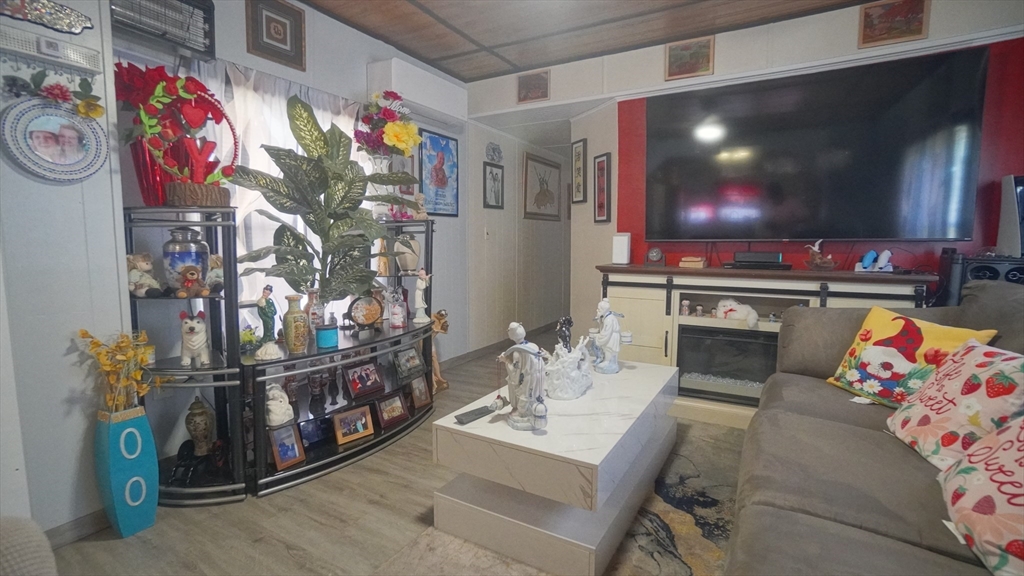 93 Grochmal Avenue, Unit 126 Springfield, MA 01151 - Photo 17 of 35 a living room with furniture and a flat screen tv