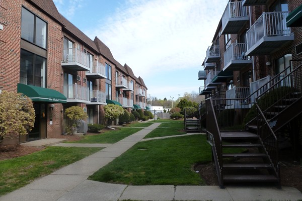 a view of buildings with yard