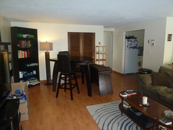 1186 Worcester Road, Unit 610 Framingham, MA 01702 - Photo 3 of 9 a living room with furniture and wooden floor