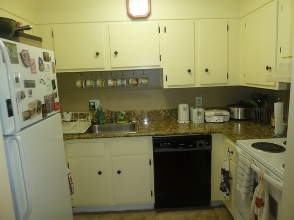 1186 Worcester Road, Unit 610 Framingham, MA 01702 - Photo 4 of 9 a kitchen with stainless steel appliances granite countertop a sink and cabinets