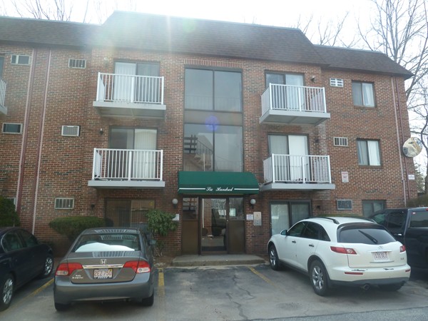 1186 Worcester Road, Unit 610 Framingham, MA 01702 - Photo 9 of 9 a car parked in front of a brick building