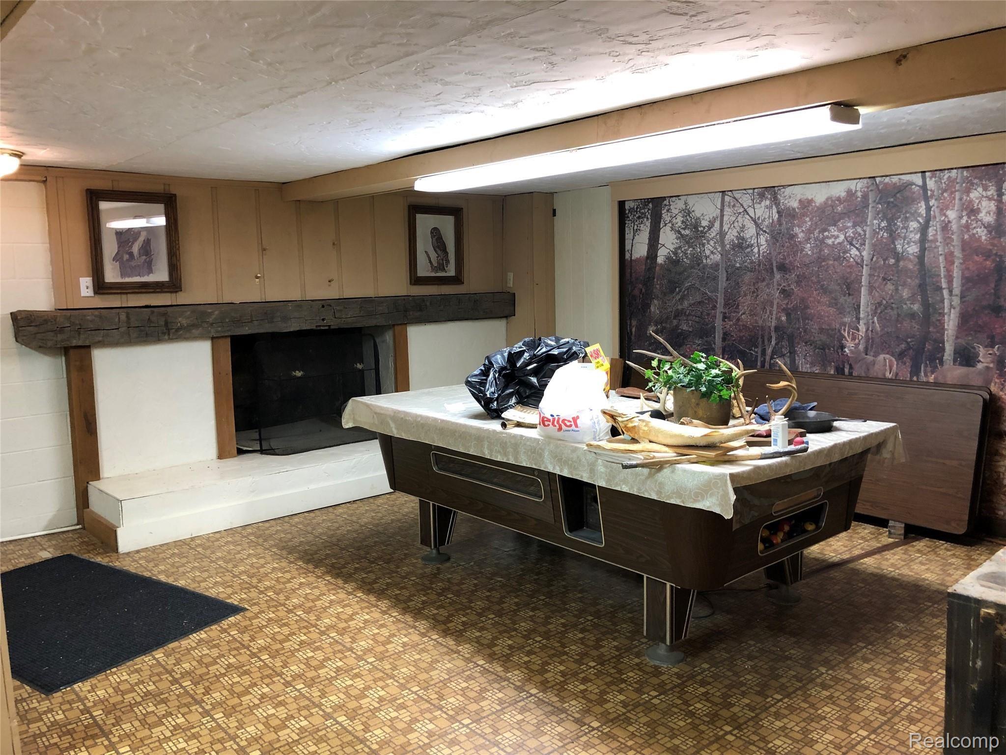 5208 Casey Road Dryden, MI 48428 - Photo 38 of 52 Finished space in basement opposite wet bar area, pool table is included in sale