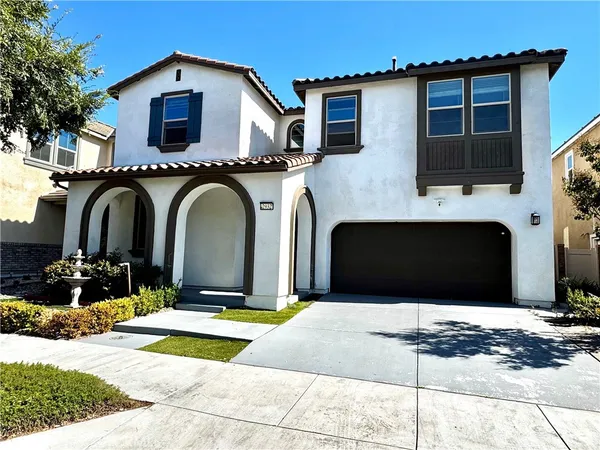 a front view of a house with yard