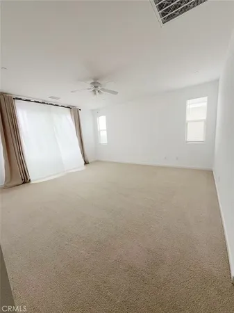 a view of a bathroom with dual sinks