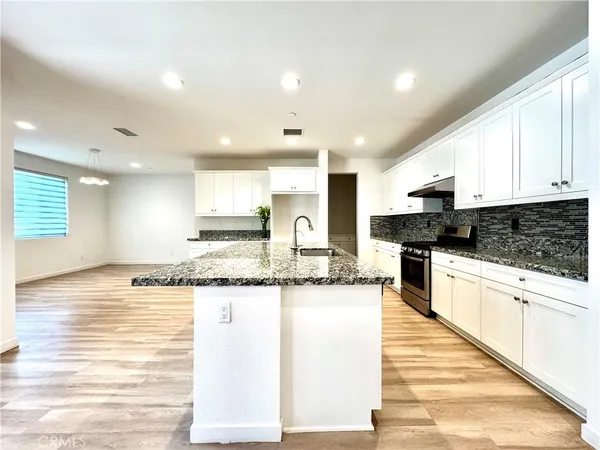 a view of an empty room and a window