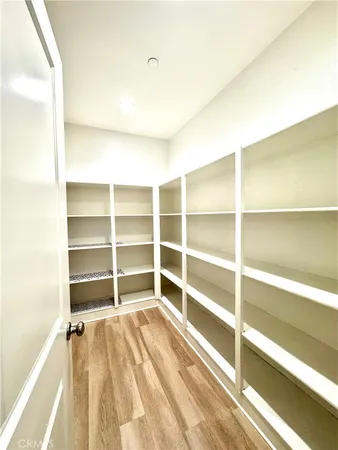 a bathroom with a granite countertop sink mirror vanity and bathtub