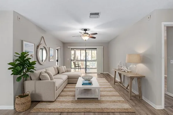 a living room with furniture and a large window
