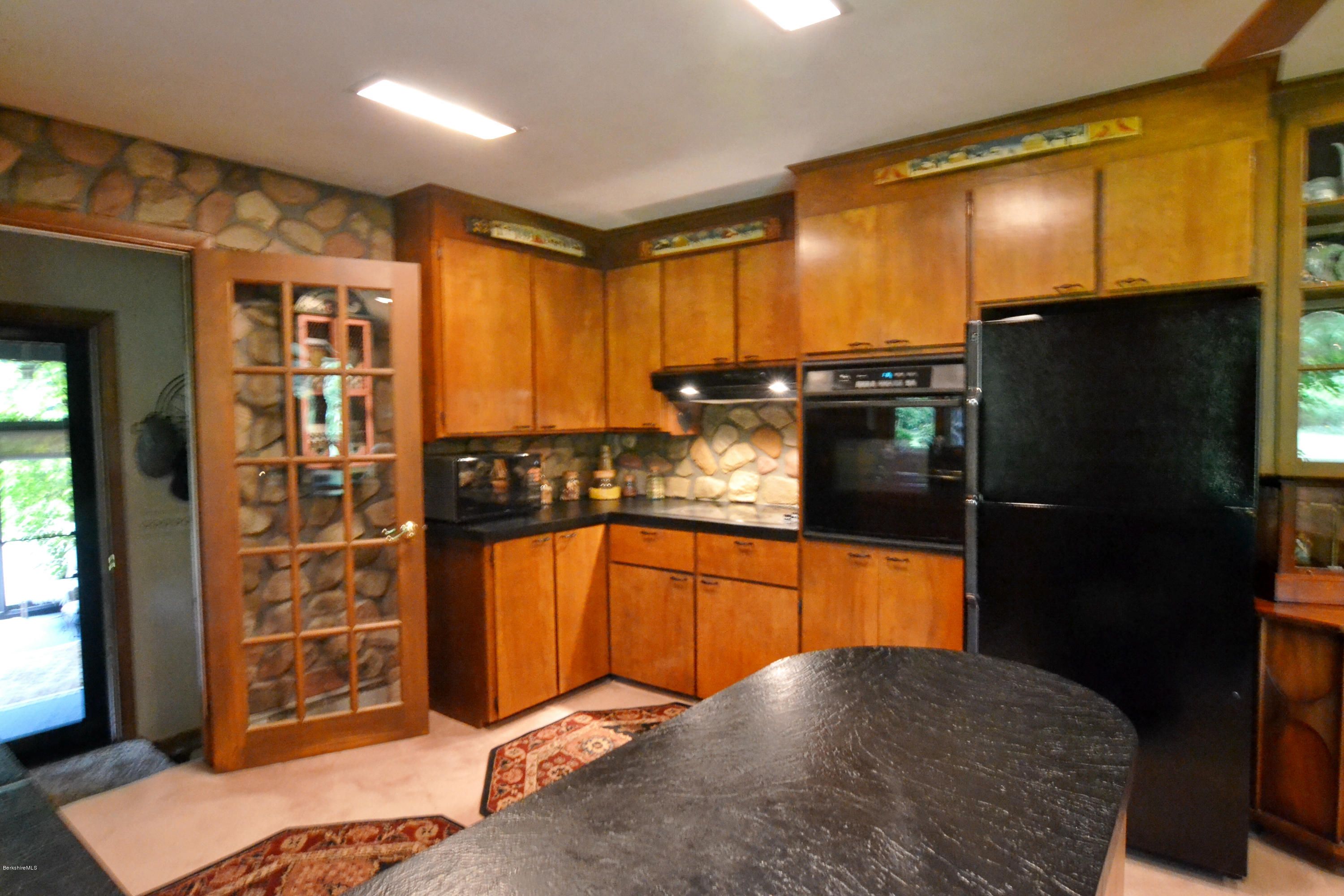 1691 Dublin Road Richmond, MA 01254 - Photo 14 of 35 a kitchen with stainless steel appliances granite countertop a refrigerator and a sink