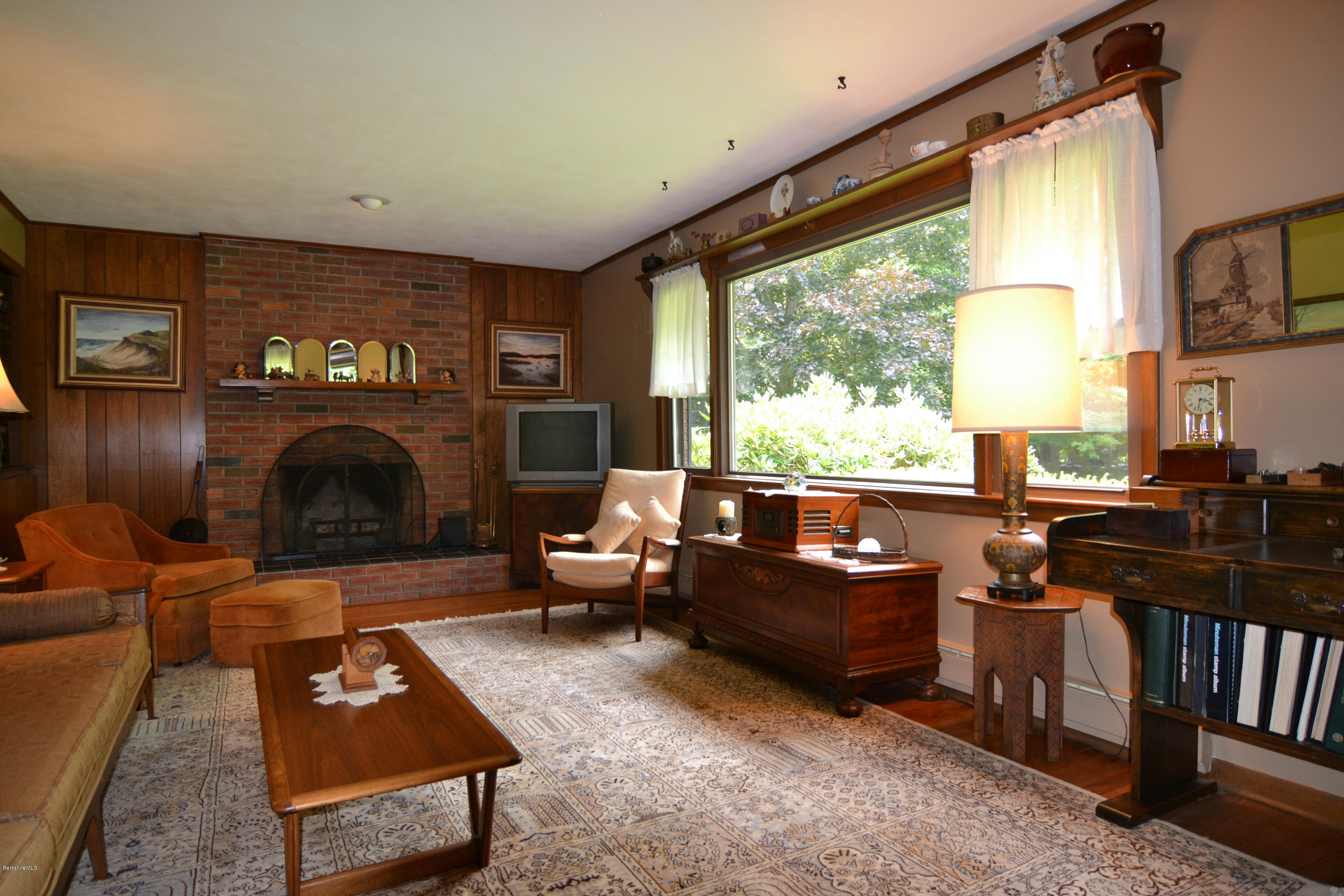 1691 Dublin Road Richmond, MA 01254 - Photo 19 of 35 a living room with furniture a fireplace and a flat screen tv