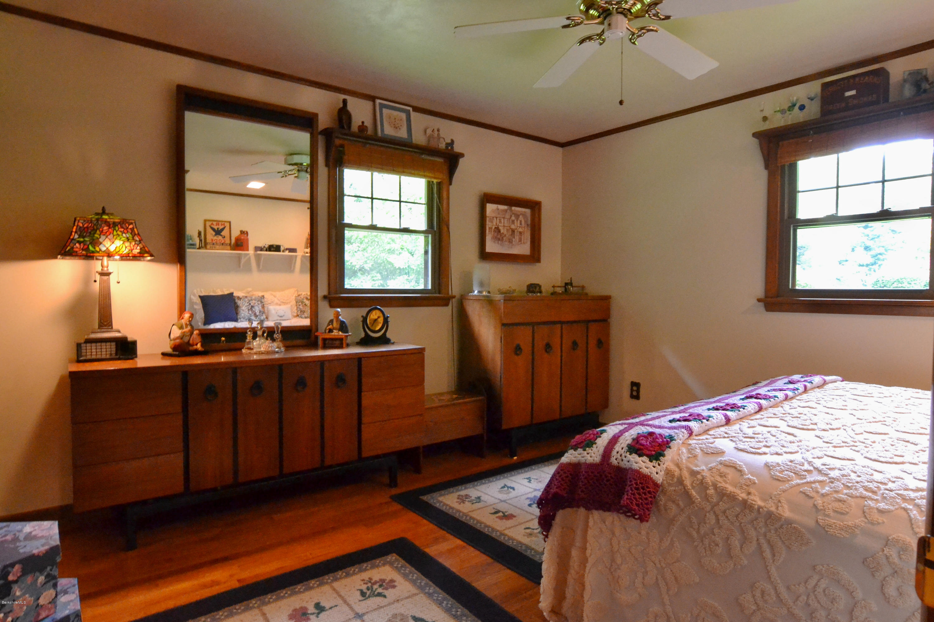 1691 Dublin Road Richmond, MA 01254 - Photo 24 of 35 a bedroom with a bed and a chandelier