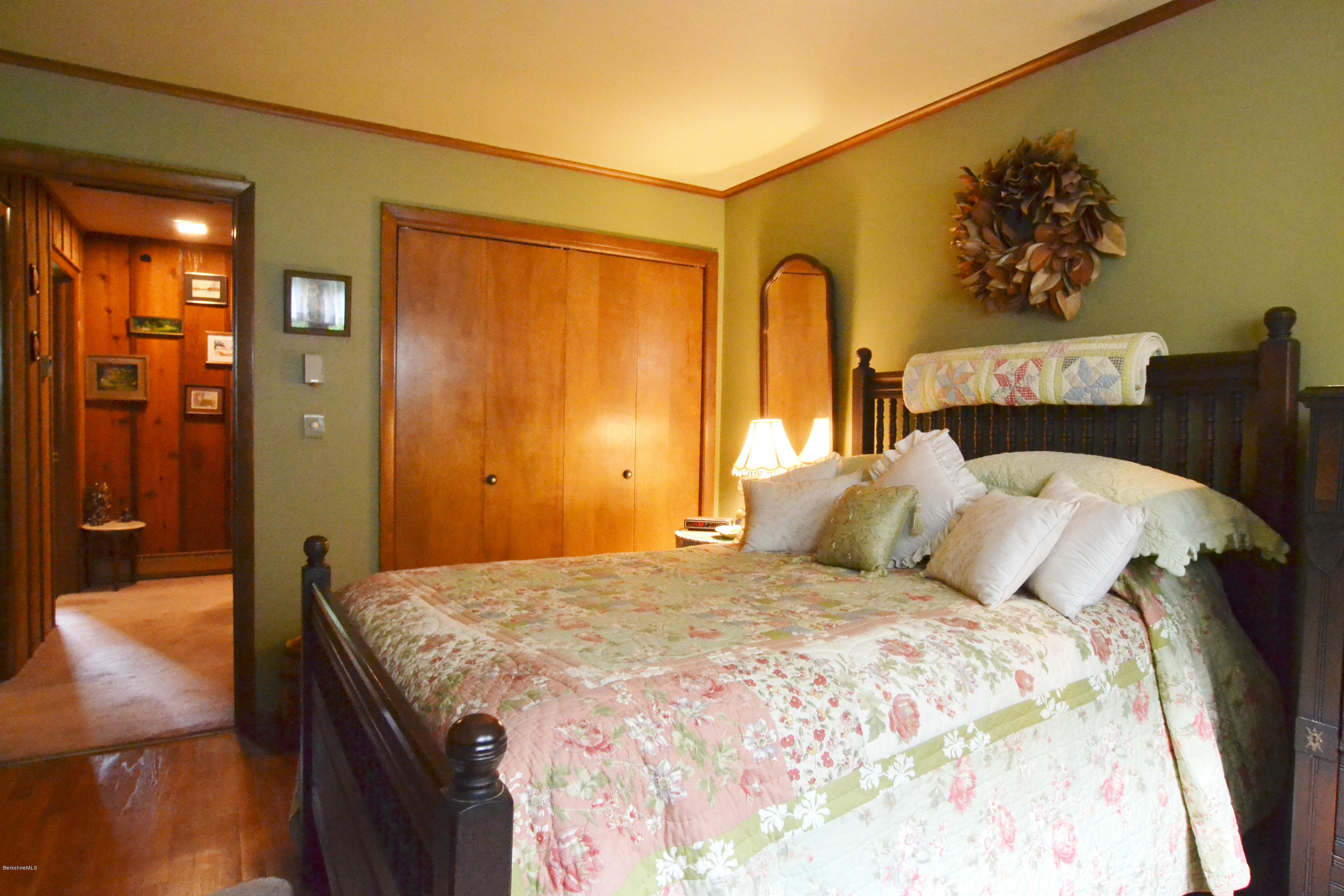 1691 Dublin Road Richmond, MA 01254 - Photo 26 of 35 a bedroom with a bed and a chandelier