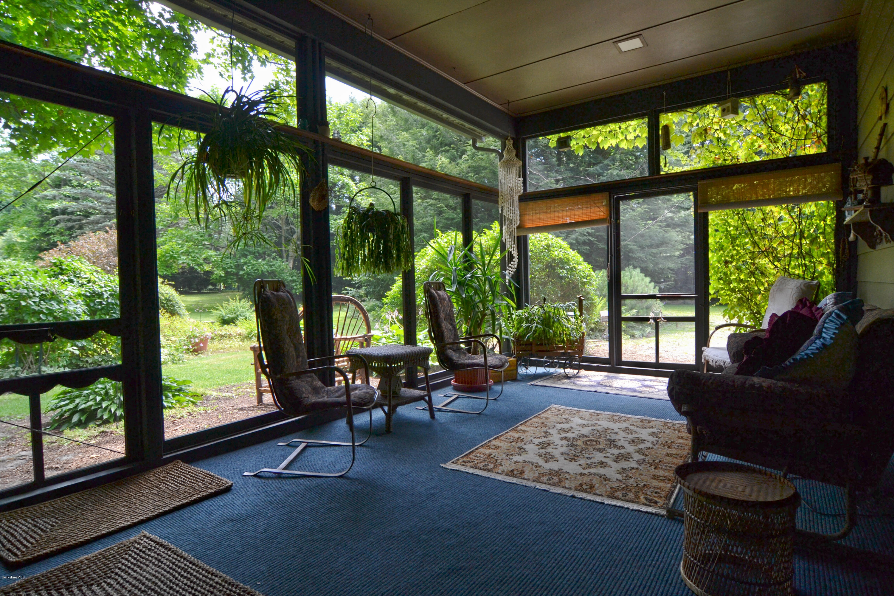 1691 Dublin Road Richmond, MA 01254 - Photo 29 of 35 a living room with furniture and floor to ceiling windows
