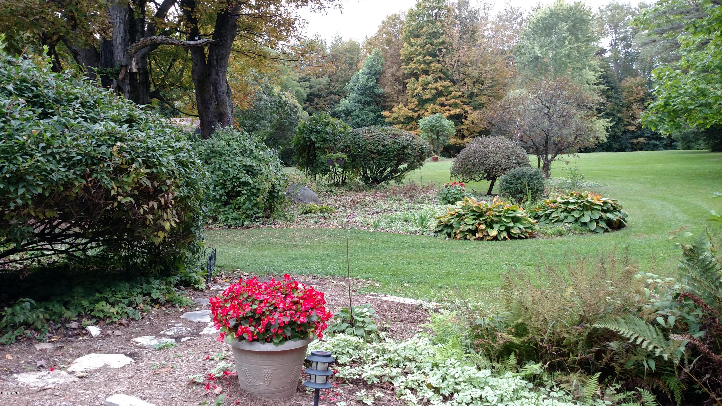 1691 Dublin Road Richmond, MA 01254 - Photo 4 of 35 a view of a garden with a fountain