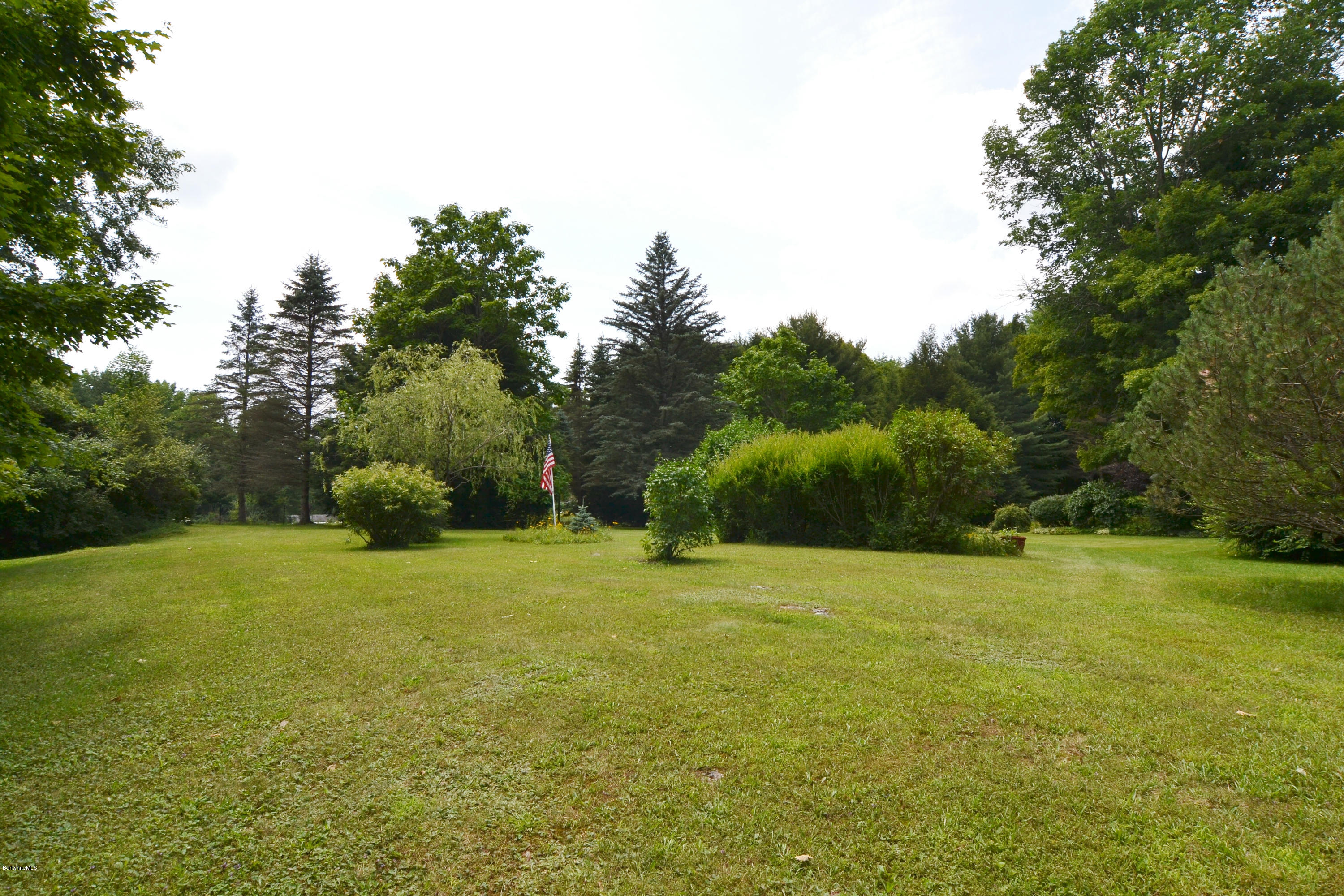 1691 Dublin Road Richmond, MA 01254 - Photo 9 of 35 a backyard of a house with lots of green space