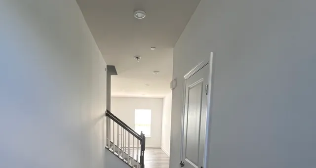 a view of a livingroom with stairs