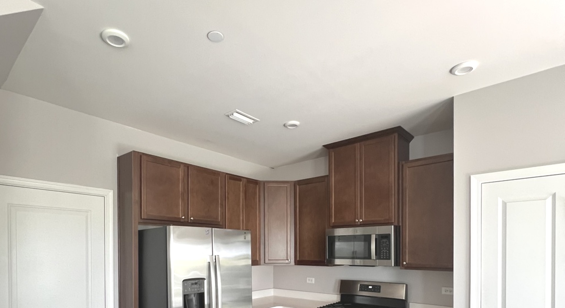 3423 Helene Rieder Drive, Unit 3423 Montgomery, IL 60538 - Photo 5 of 9 a kitchen with a refrigerator sink and microwave