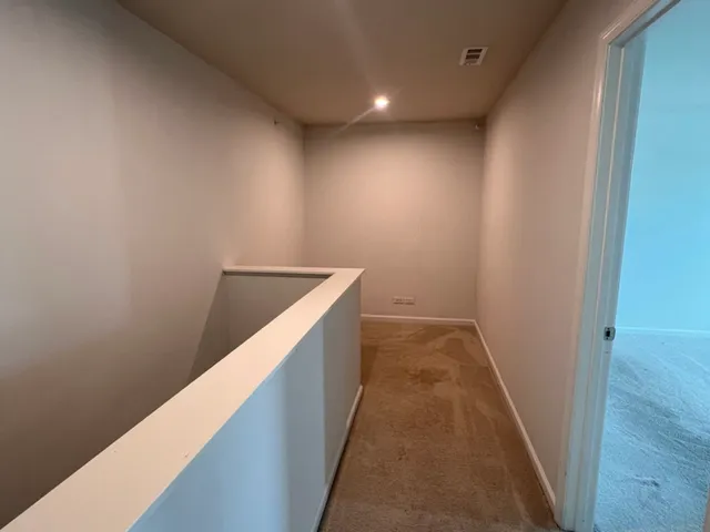 a view of hallway with stairs