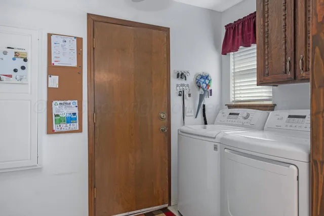 a kitchen with a sink and a refrigerator