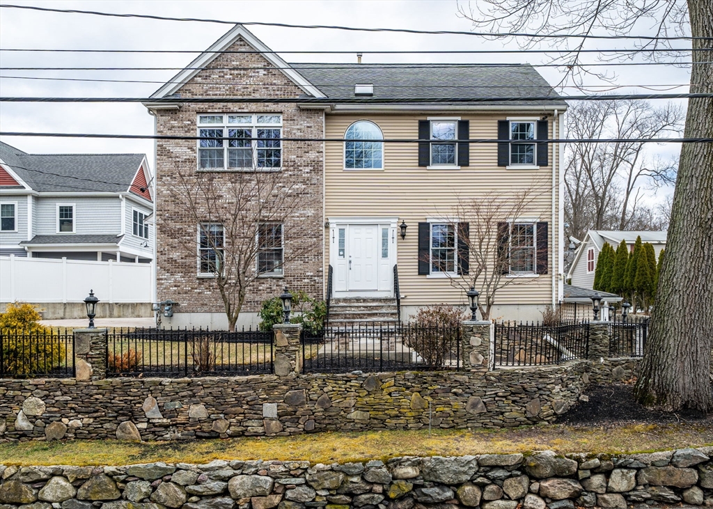 463 Sherman Street Canton, MA 02021 - Photo 1 of 1 a front view of a house with a yard