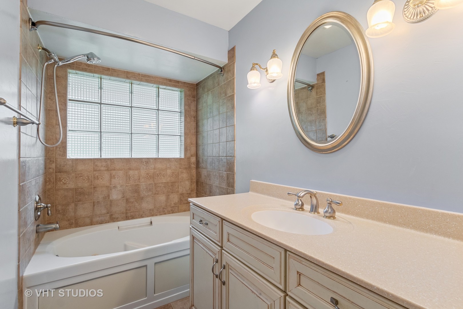 200 North Ridge Road Lake Forest, IL 60045 - Photo 14 of 22 a bathroom with a sink and a mirror