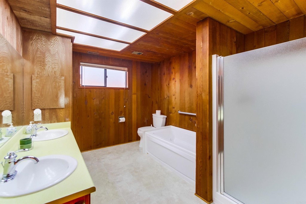 1236 Neptune Avenue Encinitas, CA 92024 - Photo 20 of 40 a bathroom with a sink and a mirror
