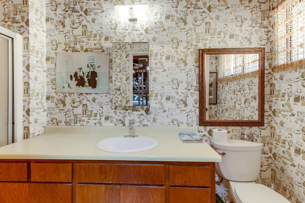 1236 Neptune Avenue Encinitas, CA 92024 - Photo 25 of 40 a bathroom with a sink and a mirror