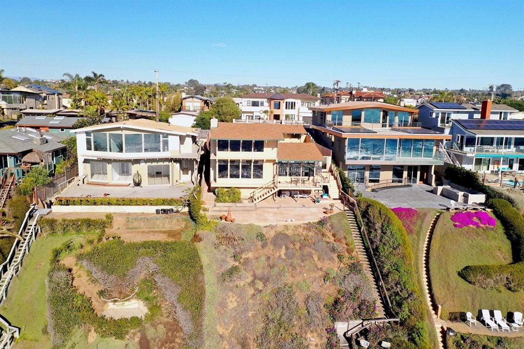 1236 Neptune Avenue Encinitas, CA 92024 - Photo 39 of 40 a view of a swimming pool with a buildings in the background