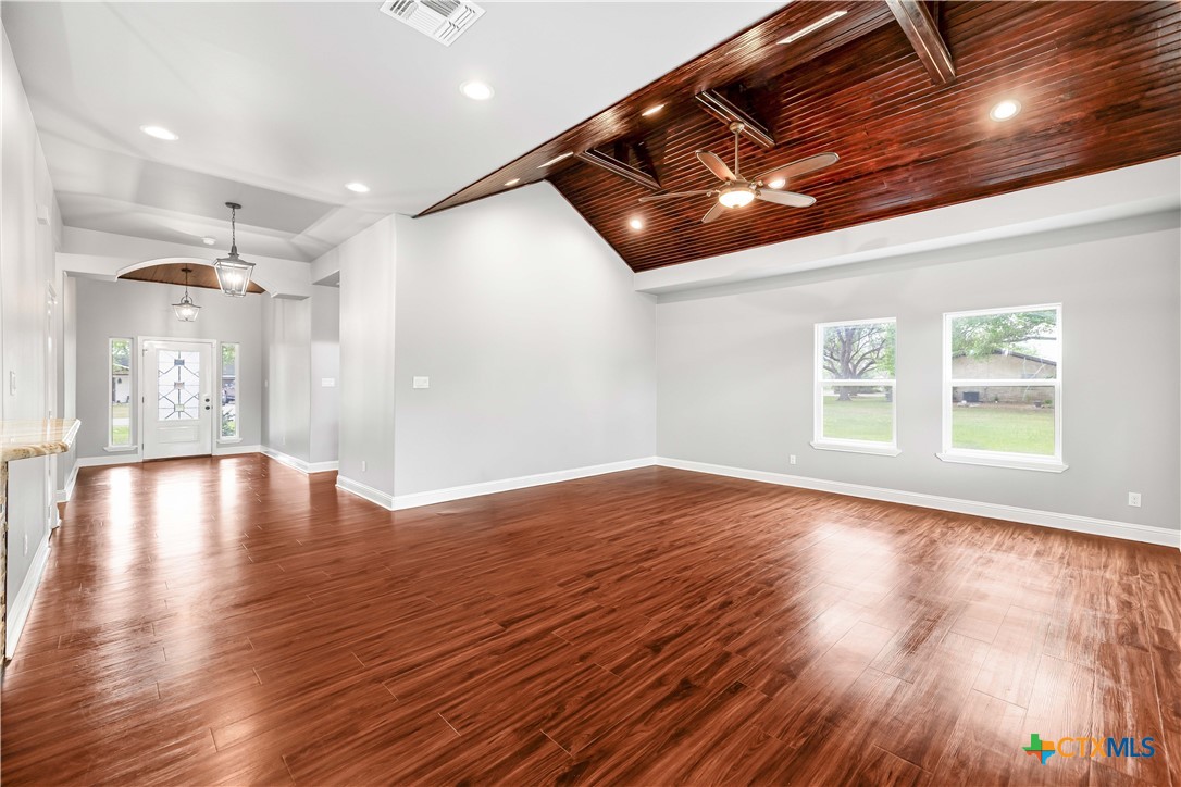 204 James Street Inez, TX 77968 - Photo 5 of 35 a view of an empty room with wooden floor and a window