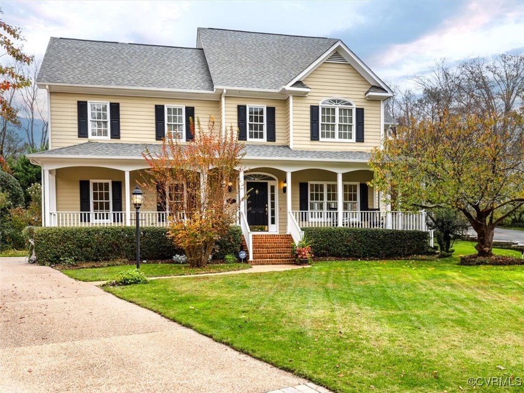 8104 Lower Ralston Road Henrico, VA 23229 - Photo 2 of 49 a front view of a house with a yard and garage