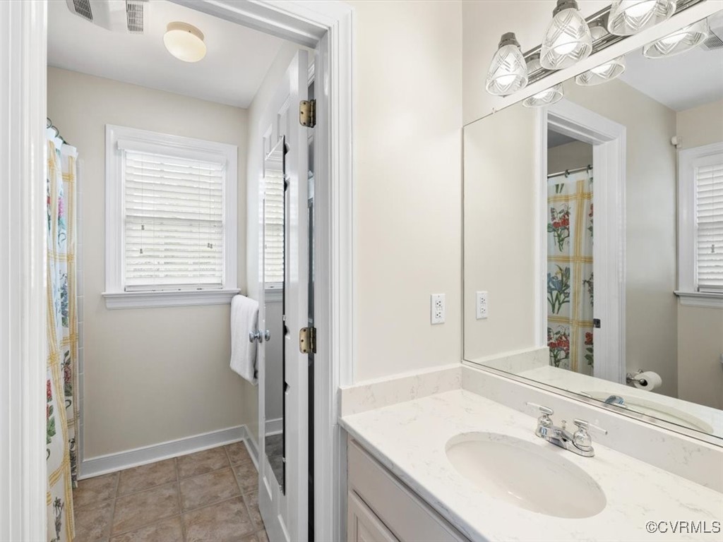 8104 Lower Ralston Road Henrico, VA 23229 - Photo 23 of 49 a bathroom with a sink double vanity and a mirror