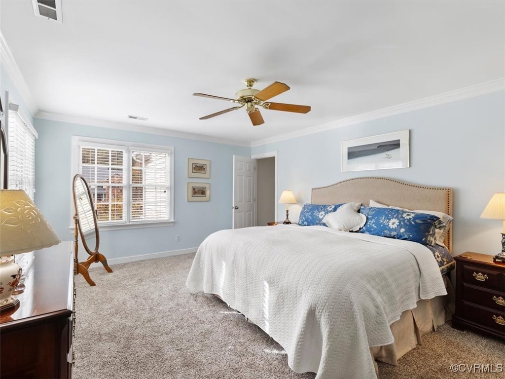 8104 Lower Ralston Road Henrico, VA 23229 - Photo 31 of 49 a spacious bedroom with a bed and a chandelier