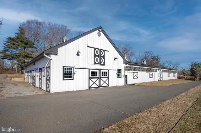 a view of residential house with wooden fence