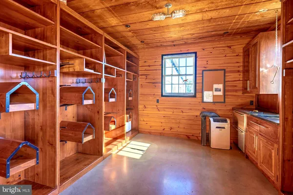 a view of a kitchen with cabinets and wooden floor