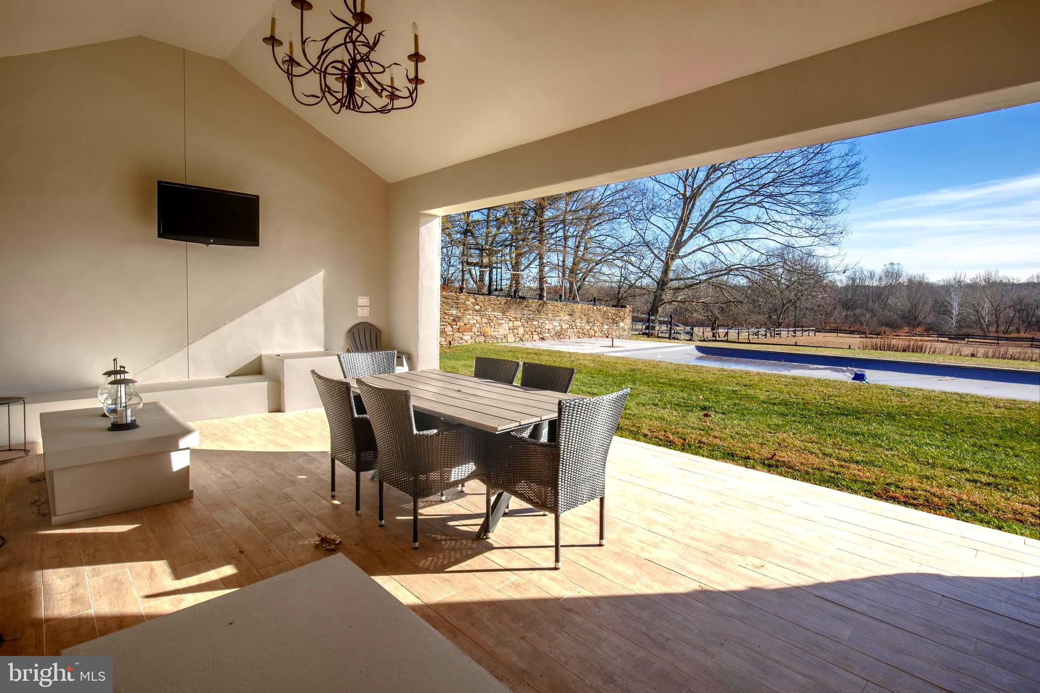 266 Province Line Road Skillman, NJ 08558 - Photo 19 of 71 Pool House-fireplace - earthy stone floors