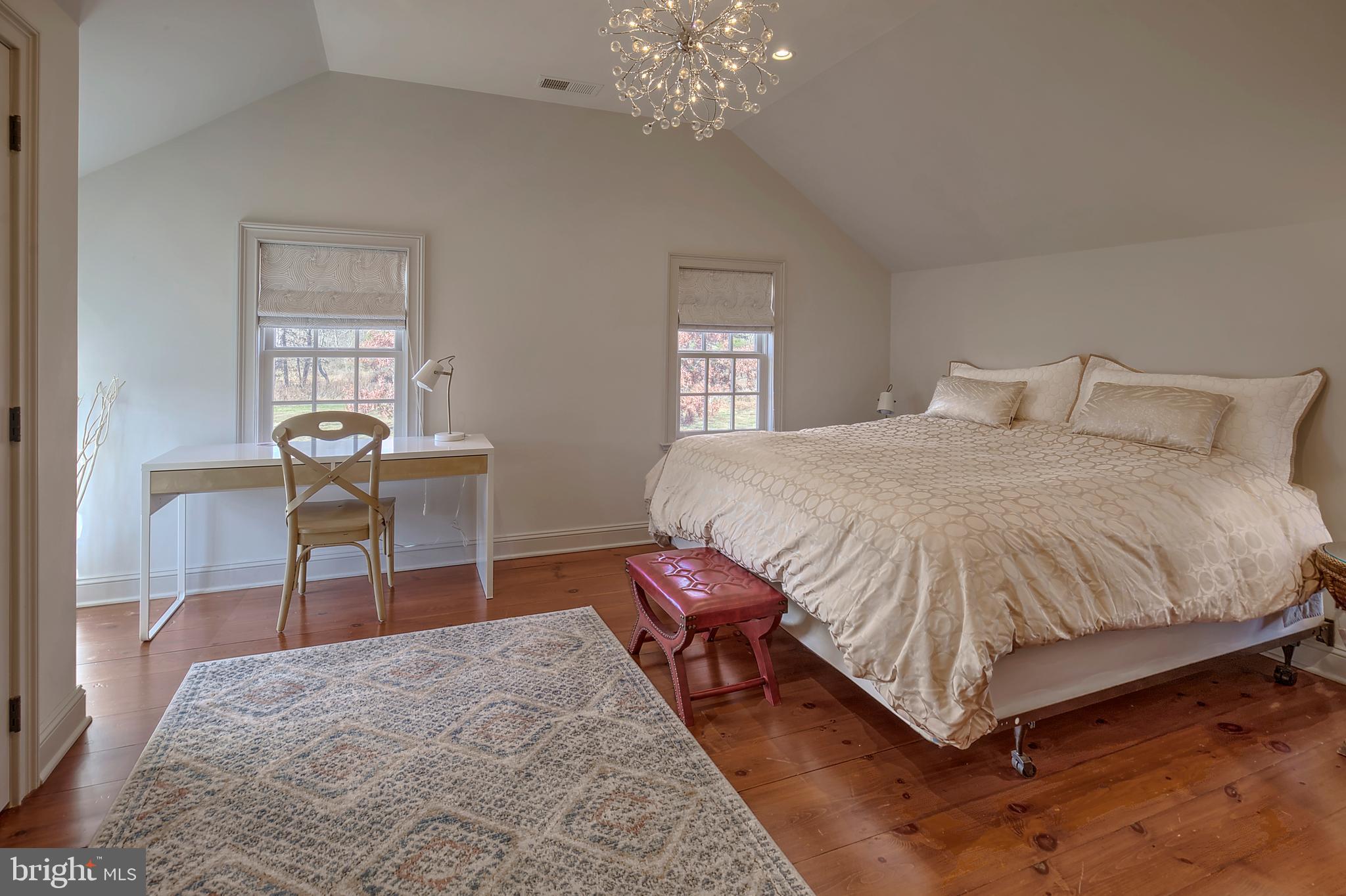 266 Province Line Road Skillman, NJ 08558 - Photo 33 of 71 a spacious bedroom with a bed and a table in it