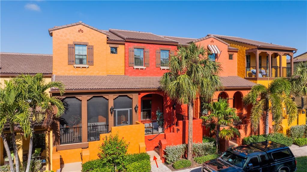 9063 Capistrano Street North, Unit 4408 Naples, FL 34113 - Photo 49 of 50 front view of a house with a street