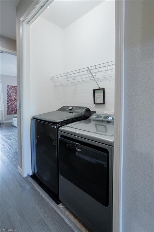 9063 Capistrano Street North, Unit 4408 Naples, FL 34113 - Photo 18 of 50 a stove top oven sitting inside of a kitchen