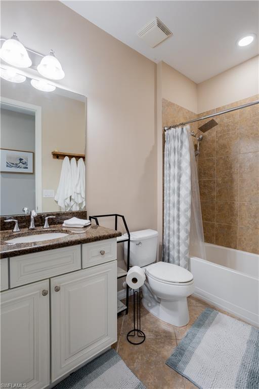 9063 Capistrano Street North, Unit 4408 Naples, FL 34113 - Photo 24 of 50 a bathroom with a sink toilet a mirror and shower