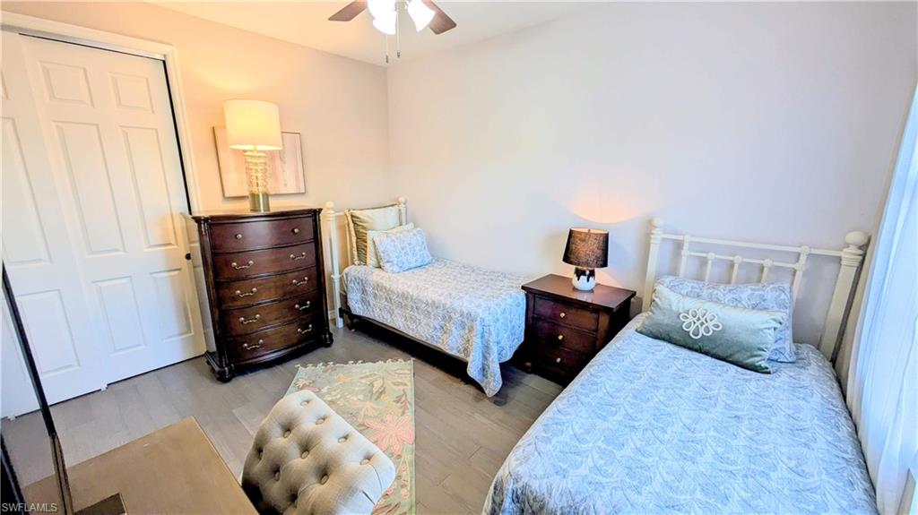 9063 Capistrano Street North, Unit 4408 Naples, FL 34113 - Photo 26 of 50 a bedroom with a bed and a window