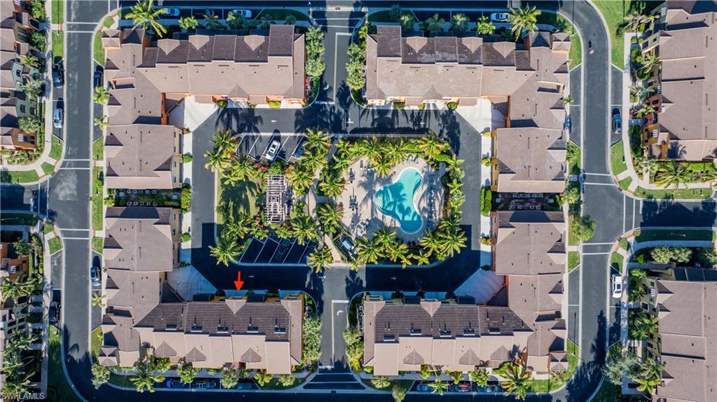 9063 Capistrano Street North, Unit 4408 Naples, FL 34113 - Photo 32 of 50 an aerial view of multiple house