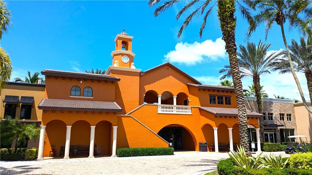 9063 Capistrano Street North, Unit 4408 Naples, FL 34113 - Photo 35 of 50 a view of a white house with large windows