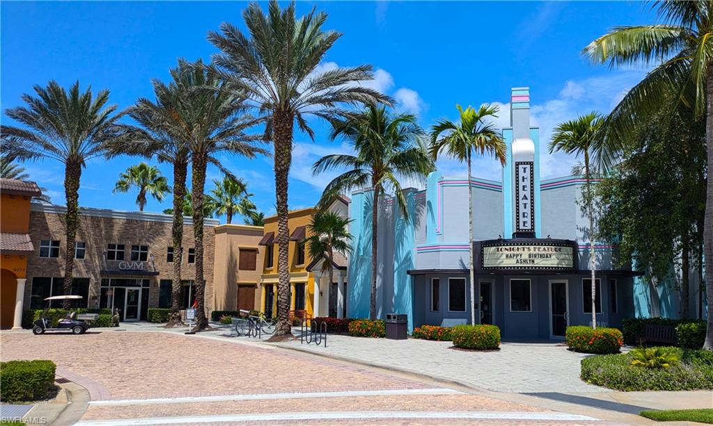 9063 Capistrano Street North, Unit 4408 Naples, FL 34113 - Photo 36 of 50 a view of a palm tree in front of a building