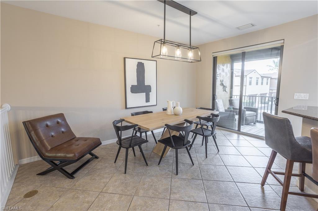 9063 Capistrano Street North, Unit 4408 Naples, FL 34113 - Photo 2 of 50 a view of a dining room with furniture window and outside view