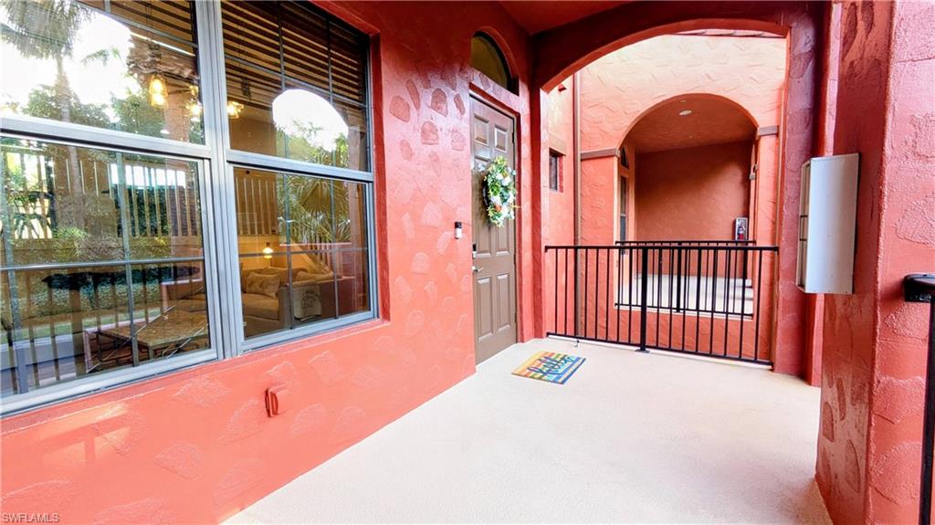 9063 Capistrano Street North, Unit 4408 Naples, FL 34113 - Photo 7 of 50 a view of a porch with a floor to ceiling window