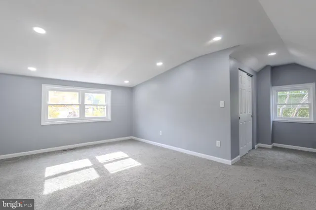 a view of empty room with windows